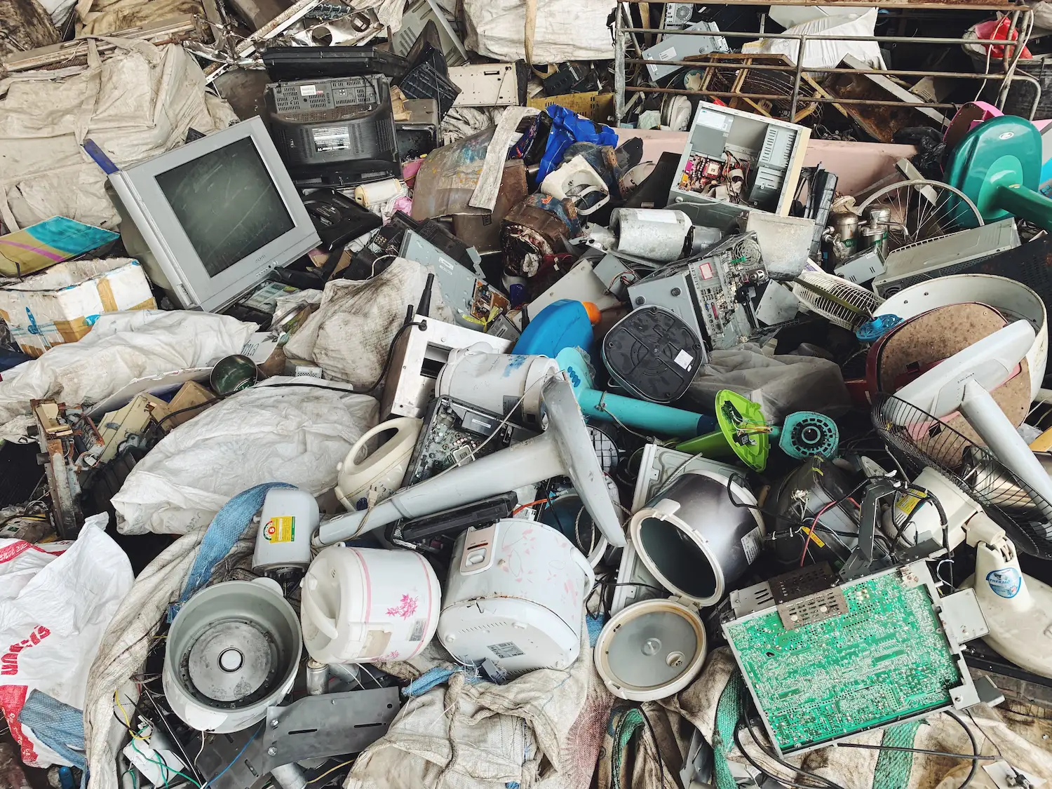 Pile of discarded electronics and appliances for recycling