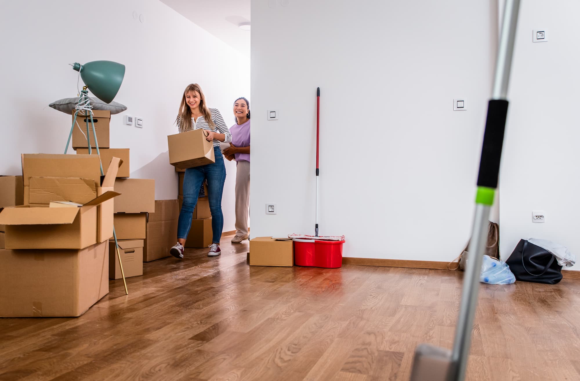 two women moving out and cleaning the apartment